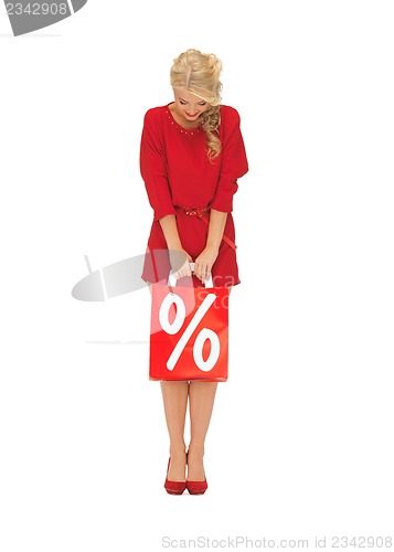 Image of beautiful woman in red dress with shopping bag