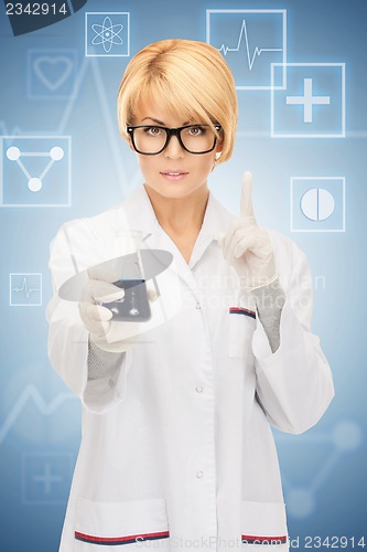 Image of lab worker holding up test tube