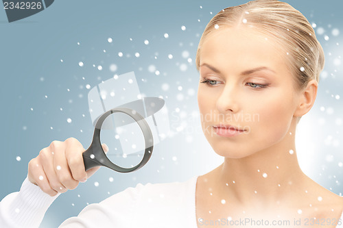 Image of woman with magnifying glass