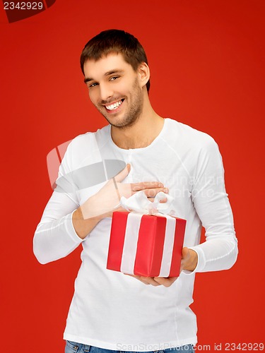 Image of handsome man with a gift