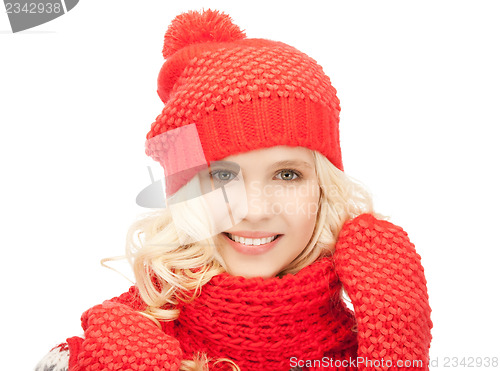 Image of beautiful woman in hat, muffler and mittens