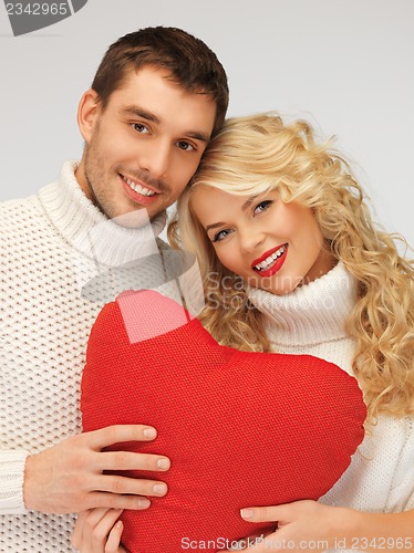 Image of family couple in a sweaters with heart