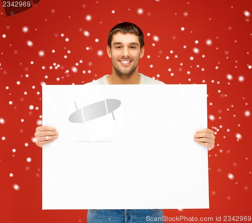 Image of handsome man with big blank board