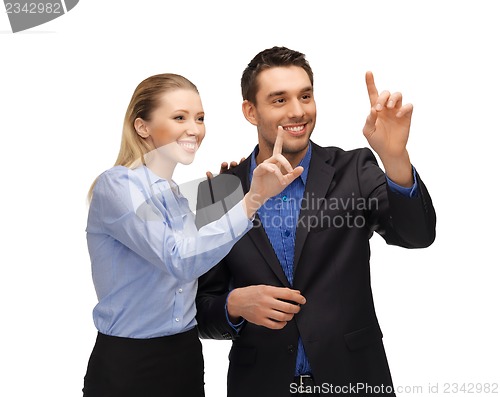 Image of man and woman working with something imaginary