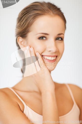 Image of face and hands of beautiful woman