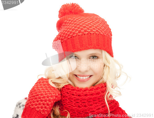 Image of beautiful woman in hat, muffler and mittens
