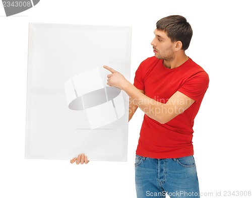 Image of handsome man with big blank board