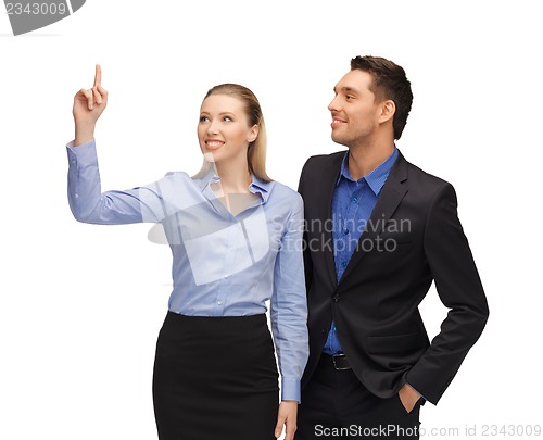 Image of man and woman pointing their fingers