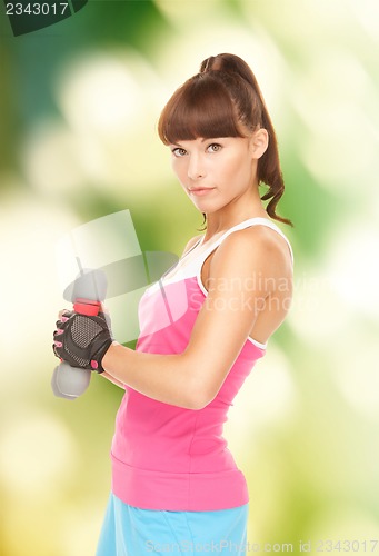 Image of fitness instructor with dumbbells