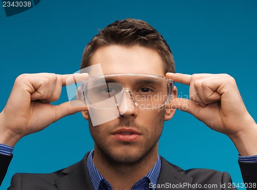 Image of businessman in protective glasses