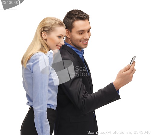 Image of man and woman reading sms