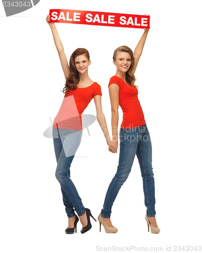 Image of two teenage girls with sale sign