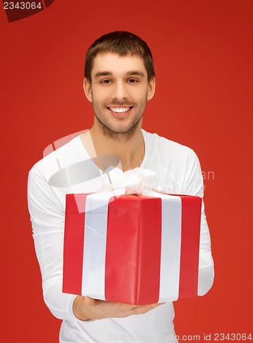 Image of handsome man with a gift