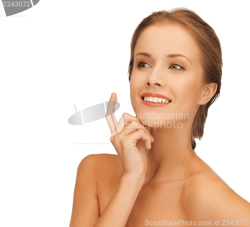 Image of beautiful woman with moisturizing creme drop