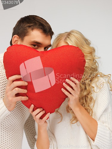 Image of family couple in a sweaters with heart
