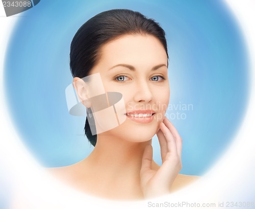 Image of face and hands of beautiful woman