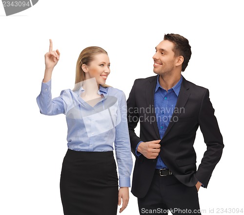 Image of man and woman pointing their fingers