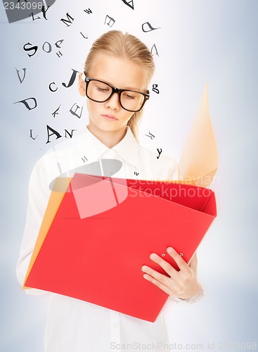 Image of elementary school student with folders