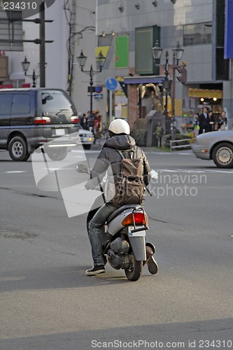 Image of Man with scooter