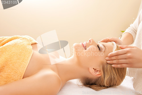 Image of beautiful woman in massage salon