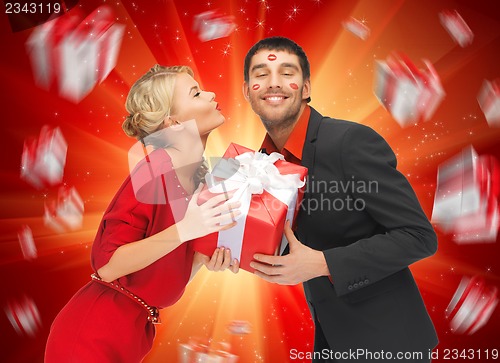 Image of man and woman with present