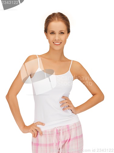 Image of happy and smiling woman in cotton pajamas