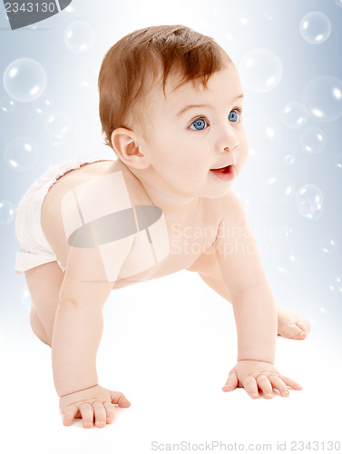 Image of crawling baby boy looking up