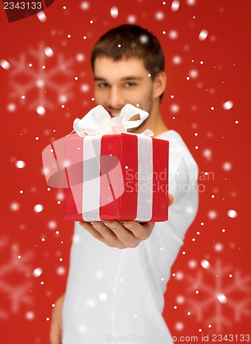 Image of handsome man with a gift