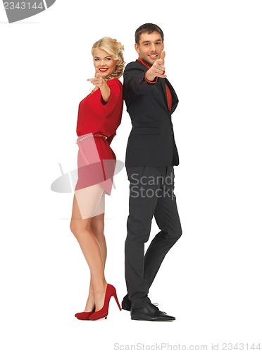 Image of man and woman making a gun gesture