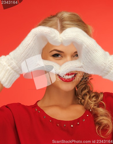 Image of lovely woman showing heart shape