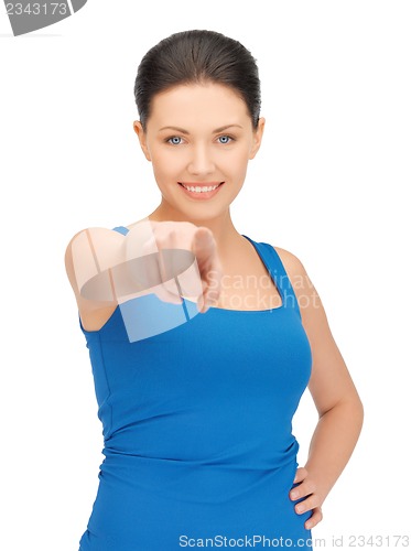 Image of beautiful woman pointing her finger