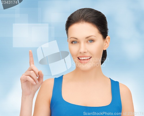 Image of beautiful woman pointing her finger