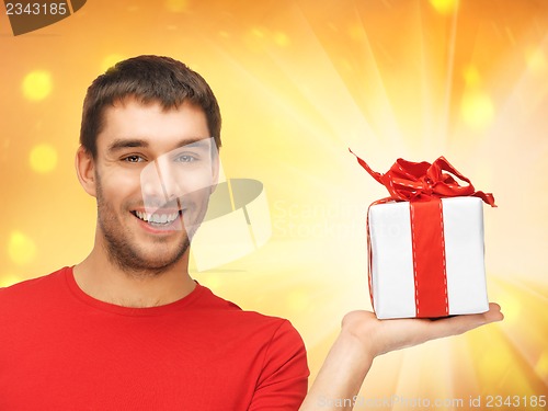 Image of handsome man with a gift