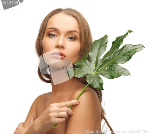 Image of woman with green leaf