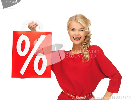 Image of beautiful woman in red dress with shopping bag