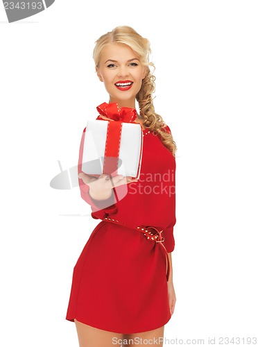 Image of lovely woman in red dress with present