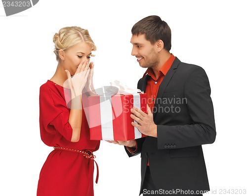 Image of man and woman with present