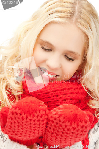 Image of beautiful woman in mittens