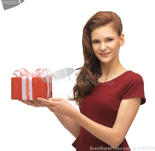 Image of teenage girl in red dress with gift box