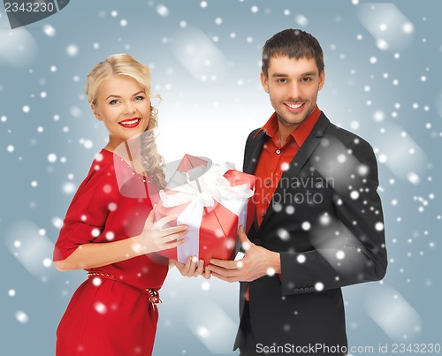 Image of man and woman with present