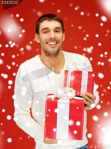 Image of man holding many gift boxes