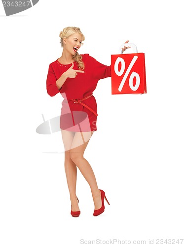 Image of beautiful woman in red dress with shopping bag