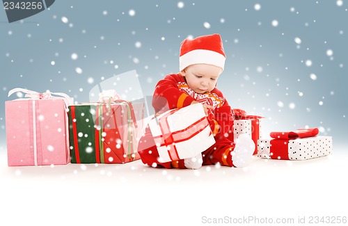 Image of santa helper baby with christmas gifts