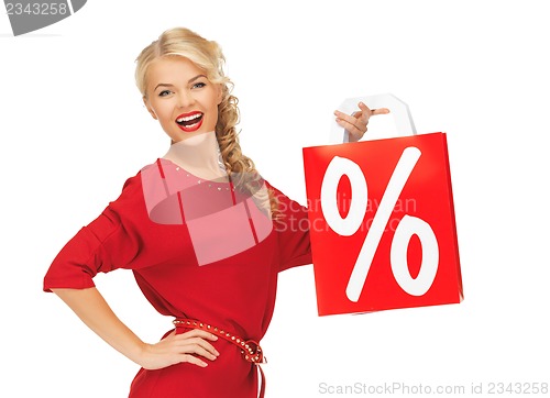 Image of laughing woman in red dress with shopping bag