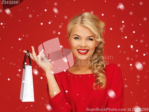 Image of lovely woman in red dress with shopping bag