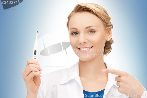 Image of attractive female doctor with thermometer