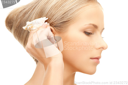 Image of beautiful woman with seashell