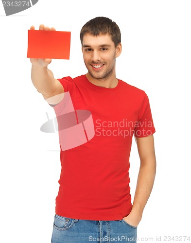 Image of handsome man with note card