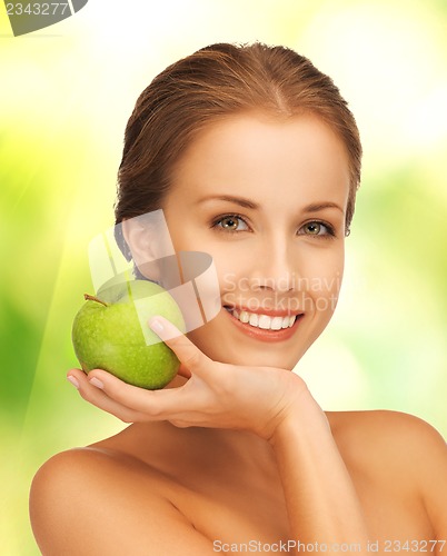 Image of young beautiful woman with green apple