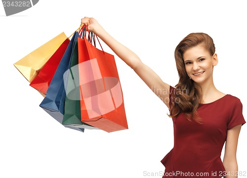 Image of happy teenage girl with shopping bags